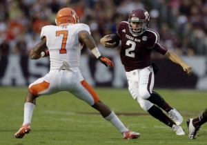 Johnny Manziel evades a tackle in Texas A&M's game against Sam Houston State on Saturday, (AP photo)
