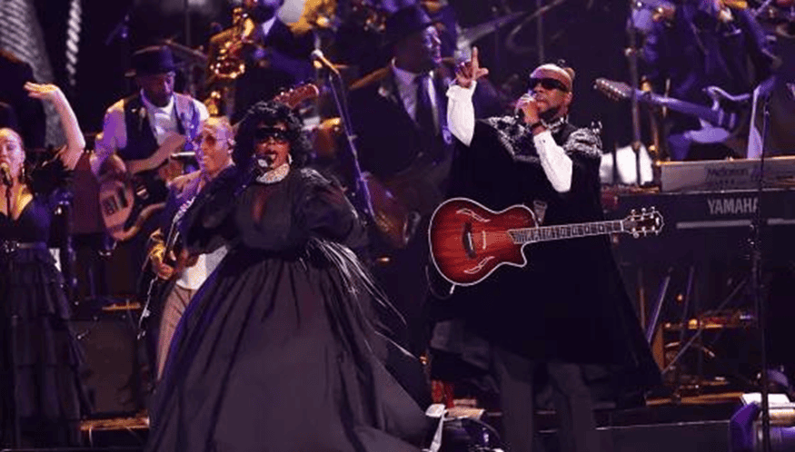 Ms. Lauryn Hill, a huge group of guest artists including Raphael Saadiq, Anthony Hamilton, Leon Thomas, Bilal, Jon Batiste, Leon Bridges, Alexia Jay, Lalah Hathaway, October London, John Legend, Chaka Khan, and Wyclef Jean run through a medley of classic D’Angelo and Roberta Flack tracks.