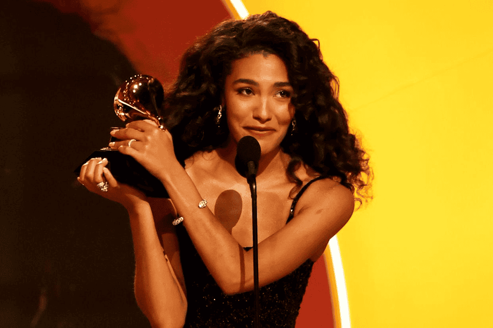 Olivia Dean accepting a Grammy